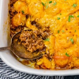 a beef and potato casserole with a spoon
