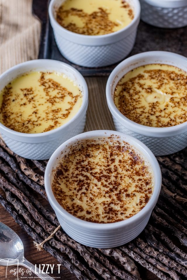 cups of baked custard with nutmeg on top