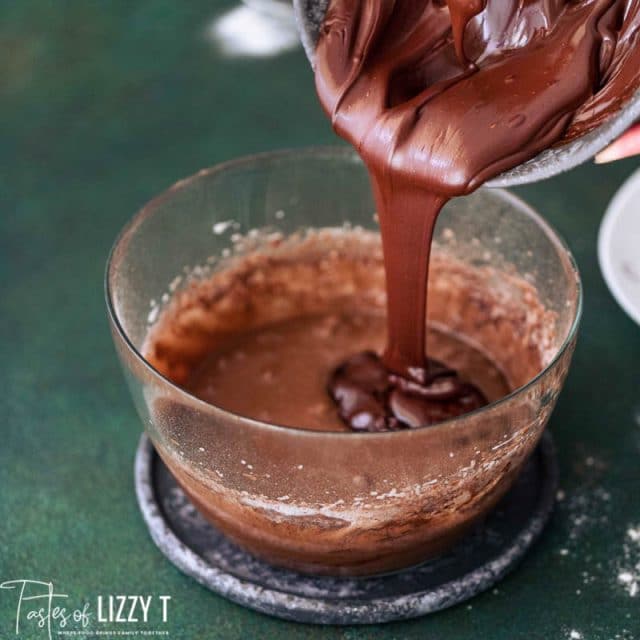 pouring chocolate into a mixing bowl