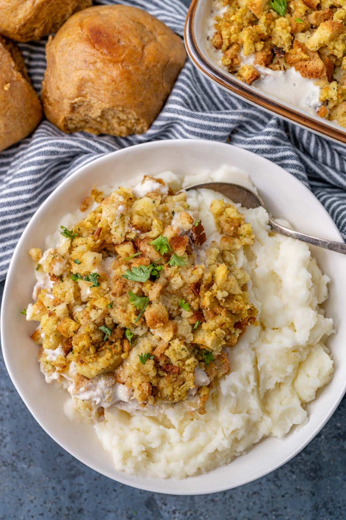 chicken stuffing casserole in a bowl with mashed potatoes