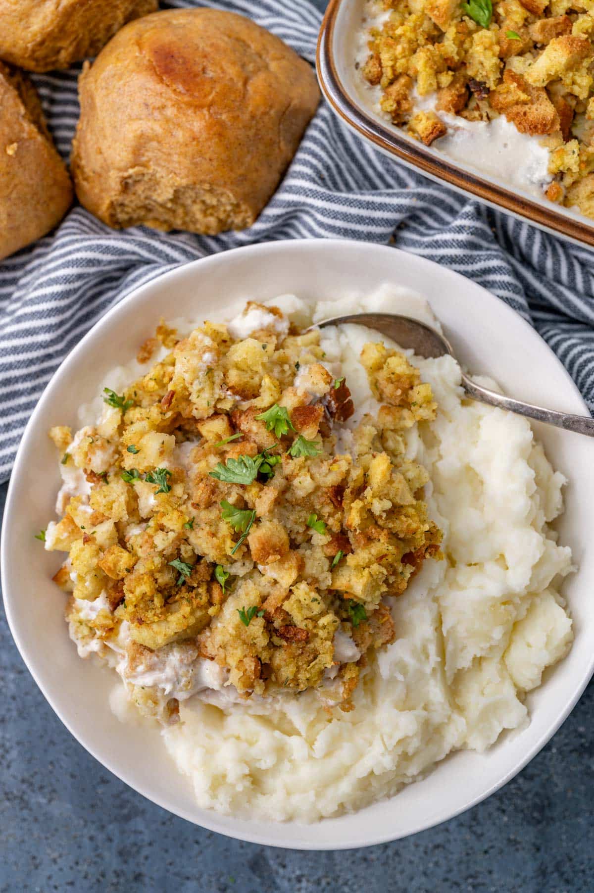 chicken stuffing casserole in a bowl with mashed potatoes