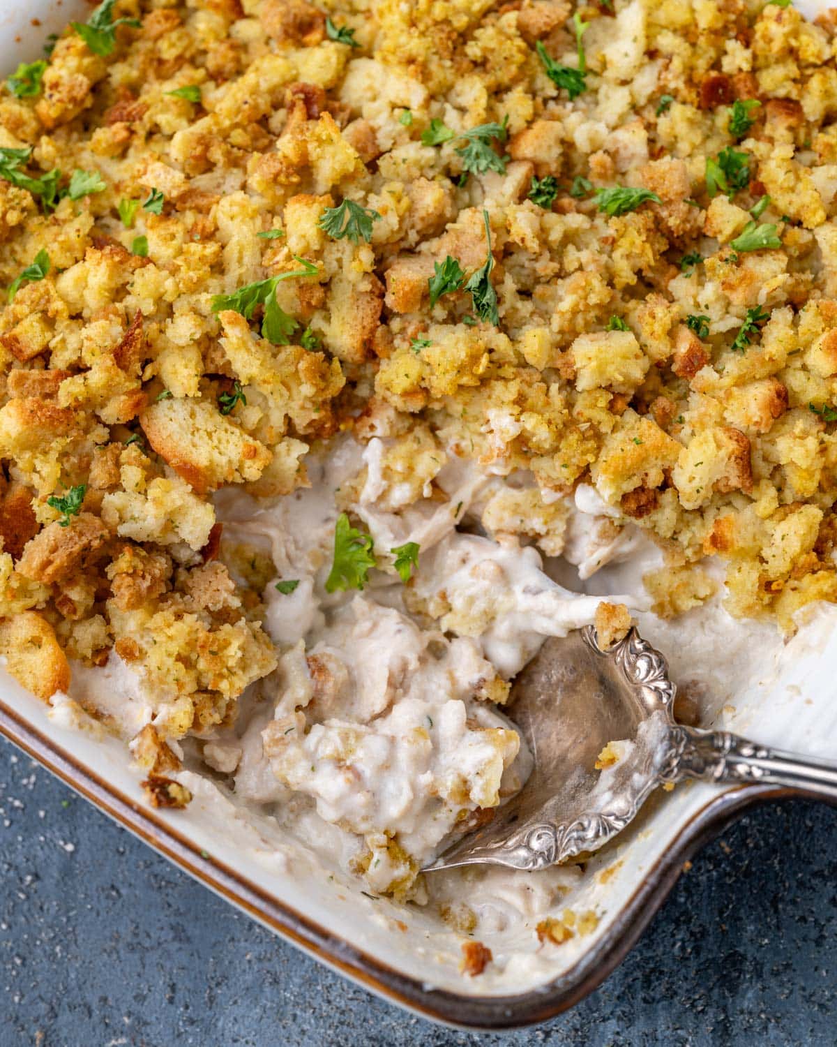 chicken stuffing casserole with a spoon in it