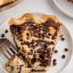 a slice of chocolate chip cake pie on a plate