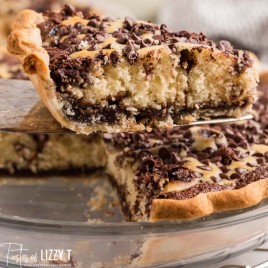 a slice of chocolate chip cake pie on a spatula