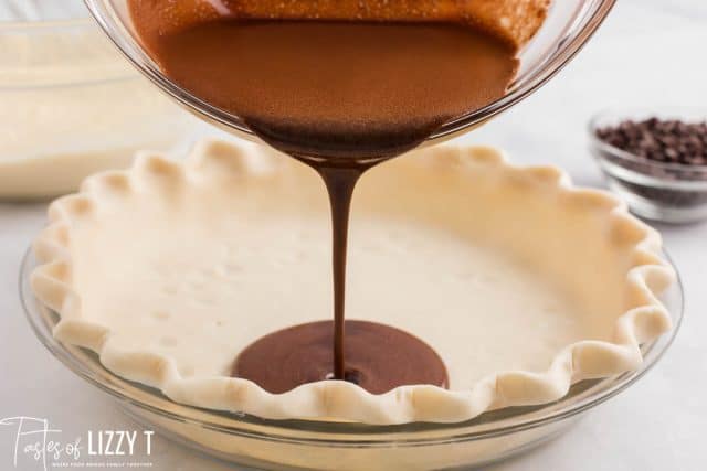 chocolate pouring into a pie shell