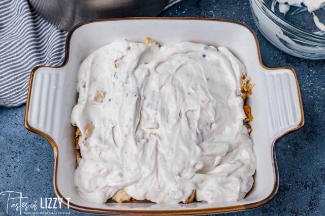 chicken with sour cream mixture spread over it