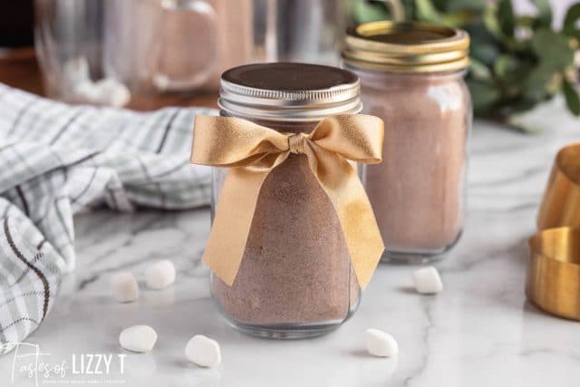 hot cocoa in a jar with a bow
