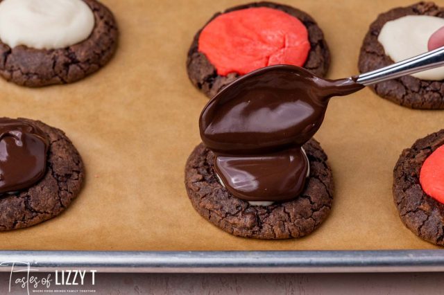 spooning chocolate on top of a cookie