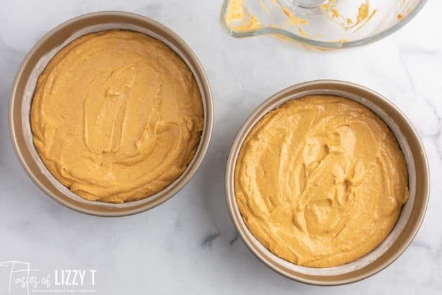 unbaked pumpkin spice cake in pans