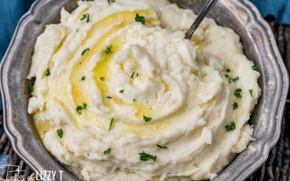 a bowl of mashed potatoes with a spoon