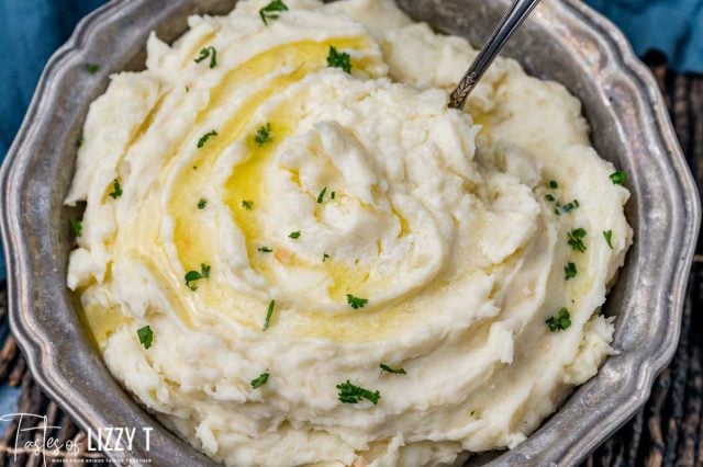 a bowl of mashed potatoes with a spoon