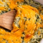 closeup of cheesy mashed potatoes in a casserole dish