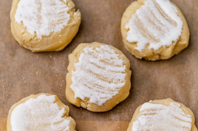 unbaked cookies with buttermilk on top