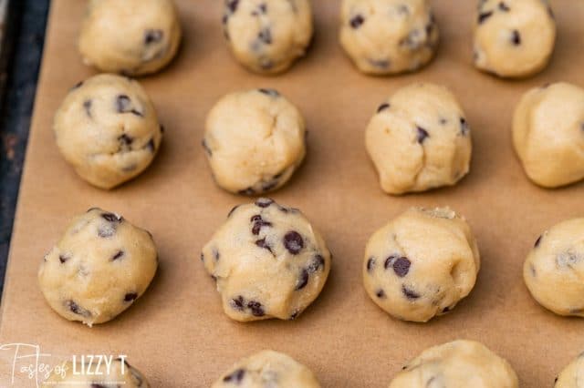 cookie dough balls on a baking sheet