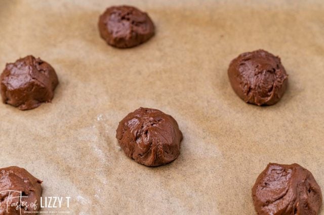 unbaked brownie cookies on parchment paper