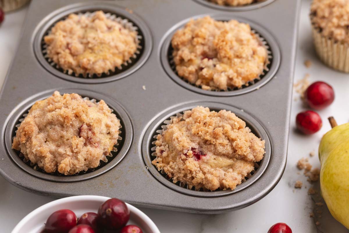 cranberry pear muffins in a pan