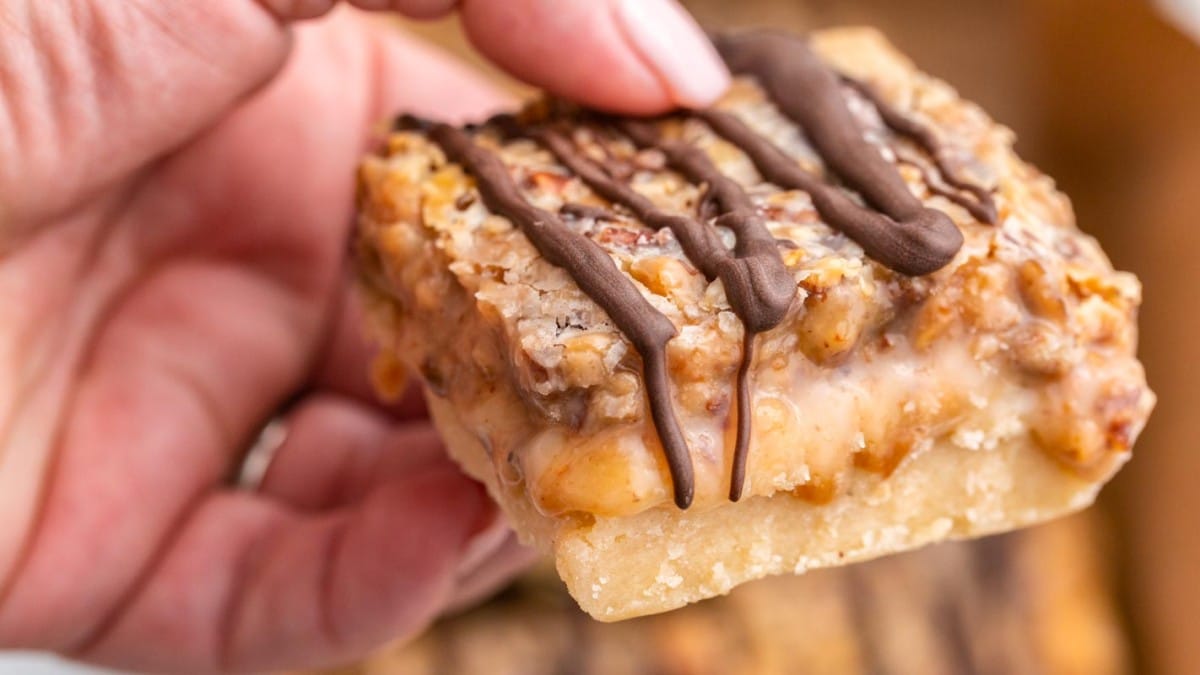 hand holding a toffee pecan shortbread bar