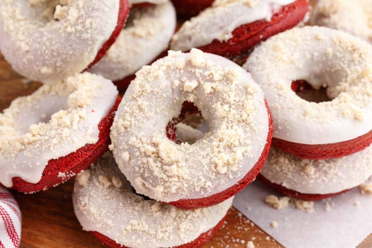 a pile of baked red velvet crumb donuts