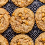 butterscotch potato chip cookies on a patterned baking sheet
