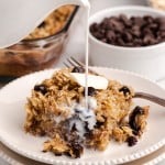 milk pouring over a plate of baked oatmeal