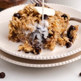 milk pouring over baked oatmeal