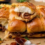 a stack of slider sandwiches with pork and cheese