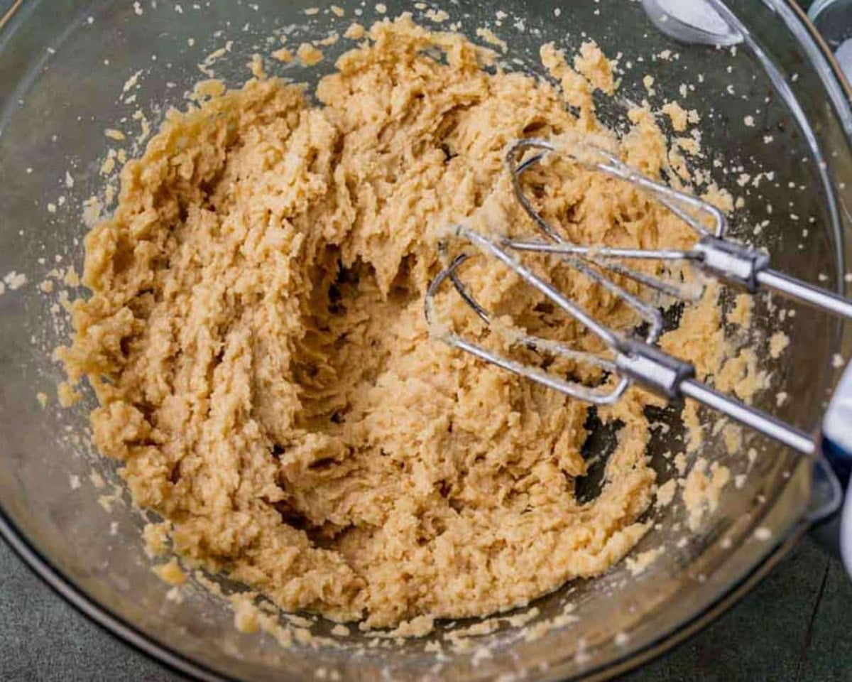cookie dough in a bowl with a mixer
