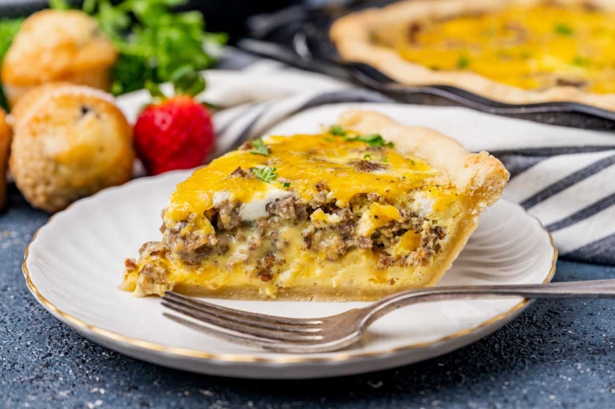 a slice of sausage breakfast pie on a table