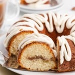 a bundt cake on a table with coffee