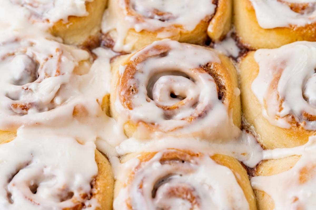 closeup of cinnamon rolls in a baking pan