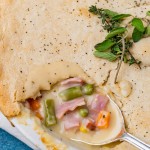 overhead shot of ham pot pie with a spoon