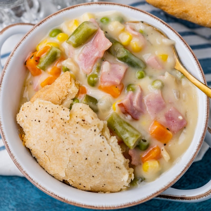 closeup of a bowl of pot pie with ham and vegetables