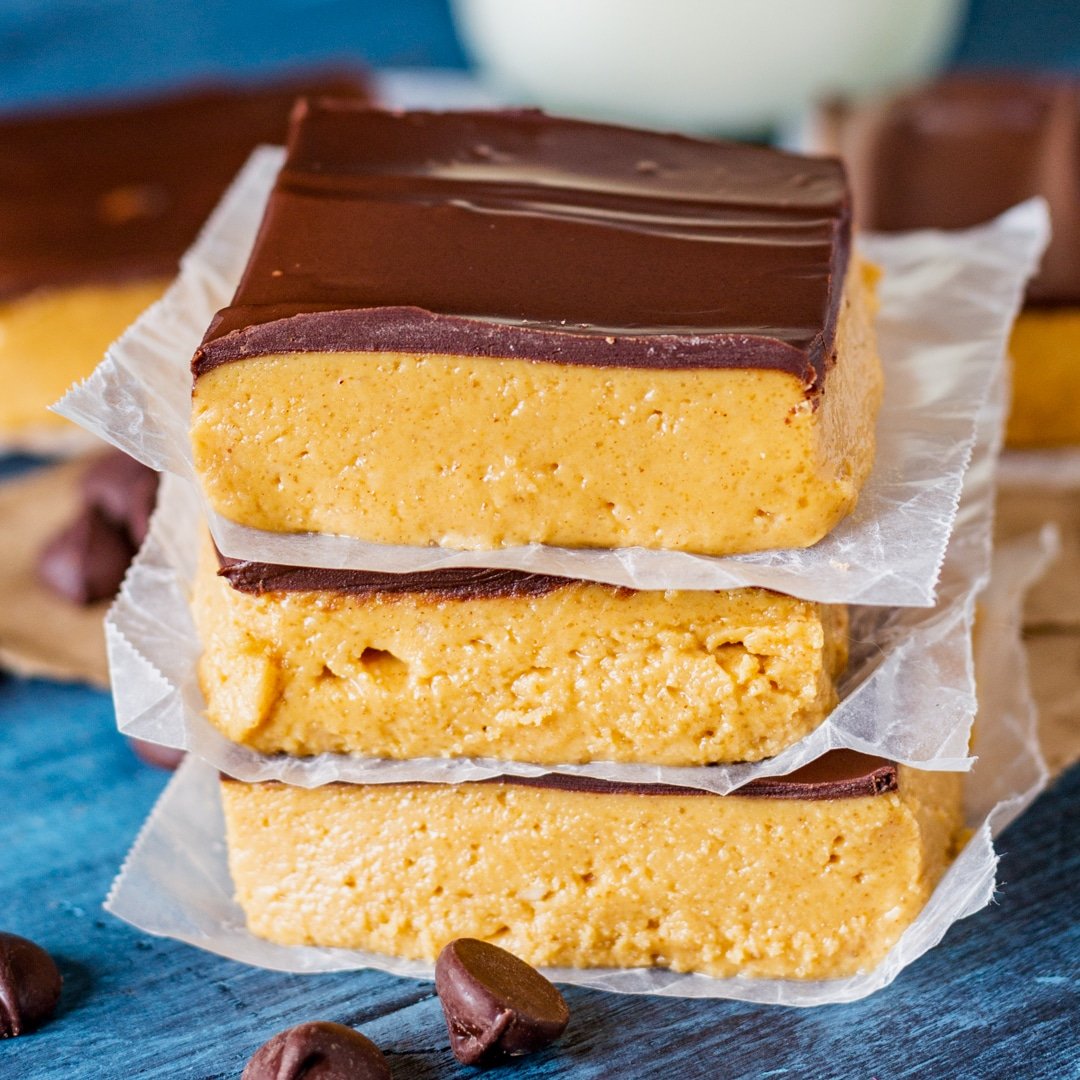 3 peanut butter squares with wax paper between them
