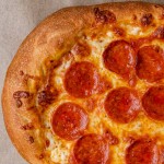 closeup of perfect pizza dough baked into crust