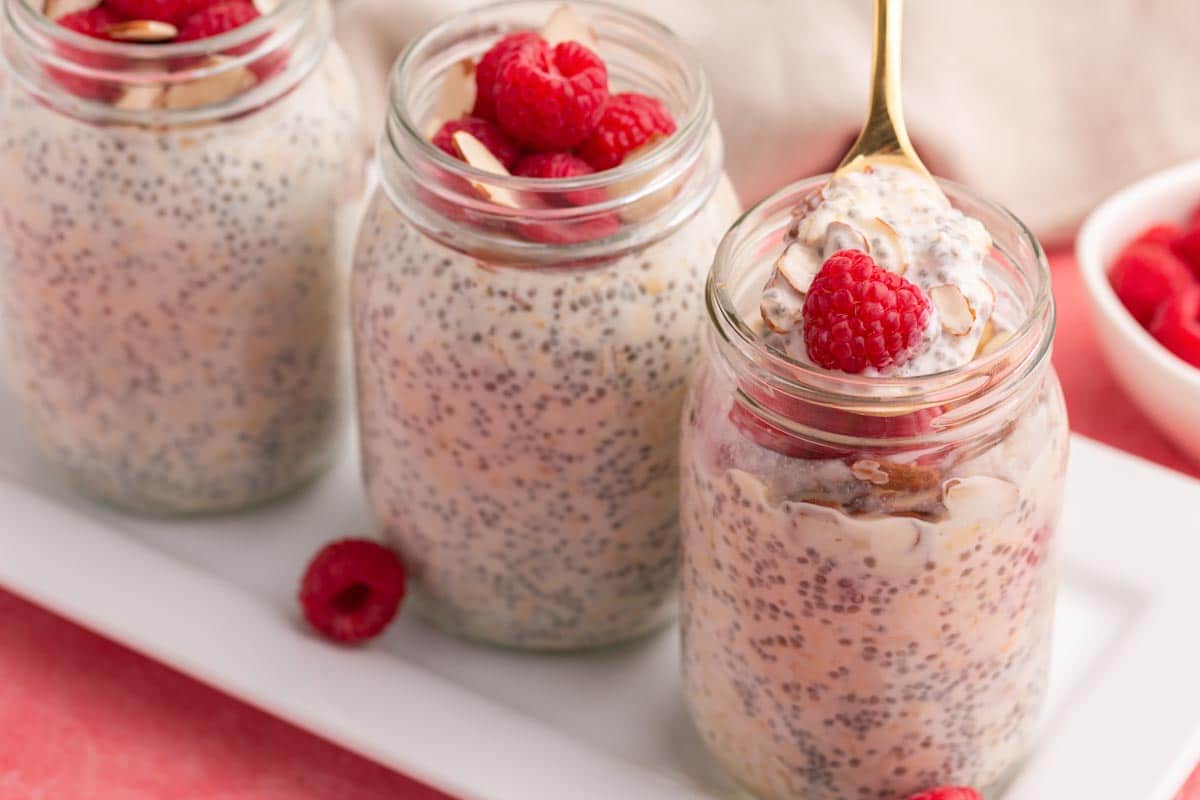 3 jars of overnight oats, one with a spoon