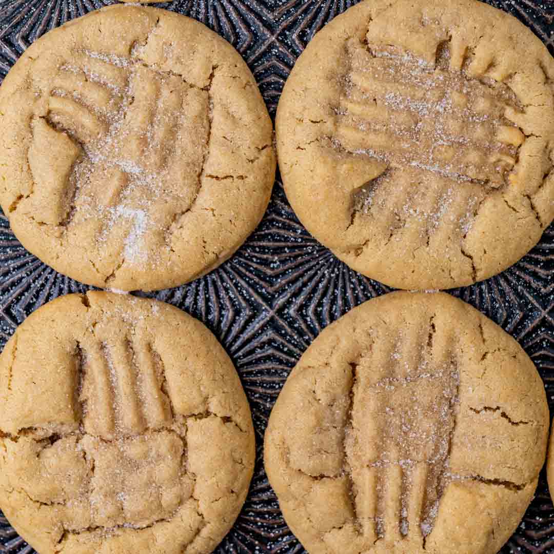 4 peanut butter cookies on a pan
