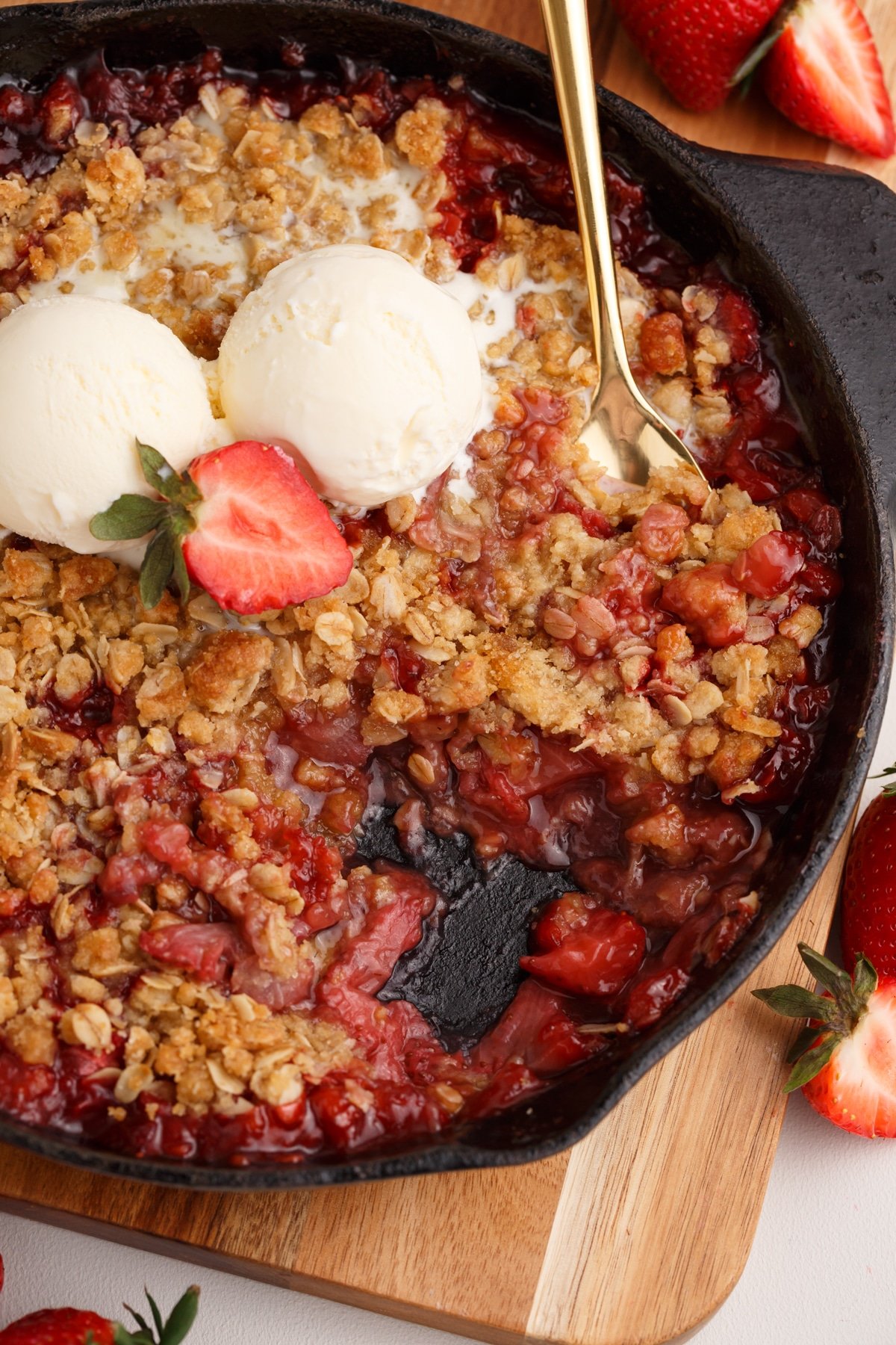 overhead view of strawberry crisp with ice cream