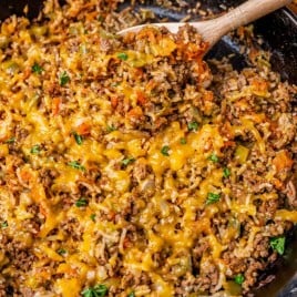 texas hash with rice, cheese and peppers in a skillet