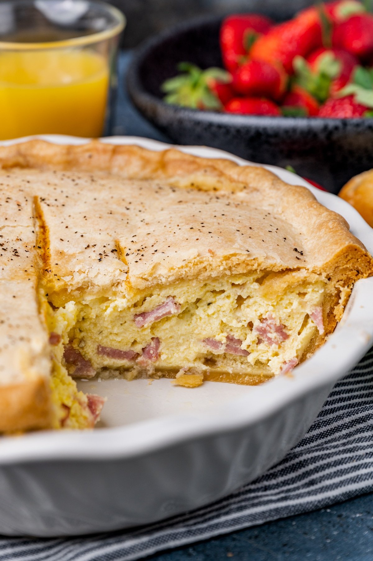 italian easter pie with ham and ricotta on a table