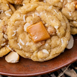 closeup of a caramel coconut macadamia nut cookie