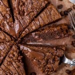 sliced wedges of chocolate chip cookie pie with chocolate drizzle