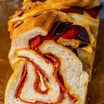 a loaf of pizza babka with a slice cut