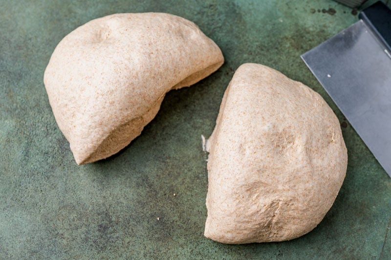 dough cut in half on a table