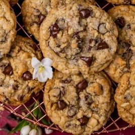 overhead view of a pile of cookies with a white flour