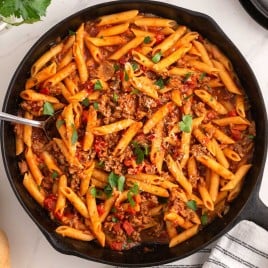 overhead view of a pasta skillet with ground sausage
