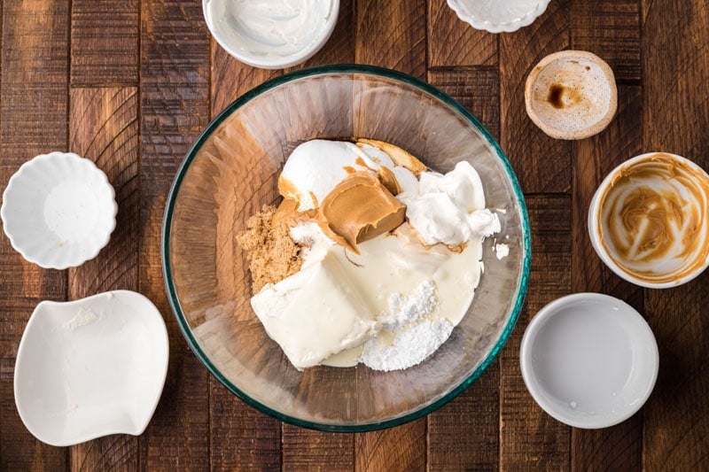 peanut butter, cream cheese, fluff and sugar in a bowl