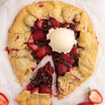 overhead view of a sliced galette with strawberries and ice cream