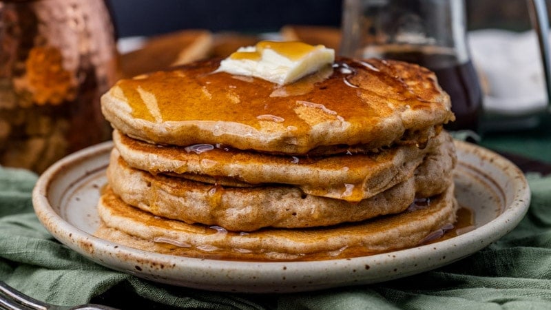 whole wheat sourdough pancakes with butter and syrup