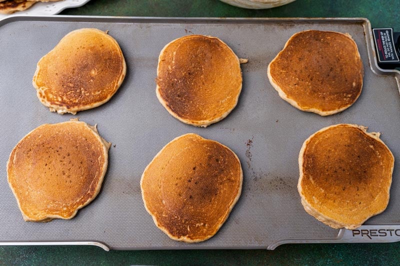 overhead view of pancakes on a griddle