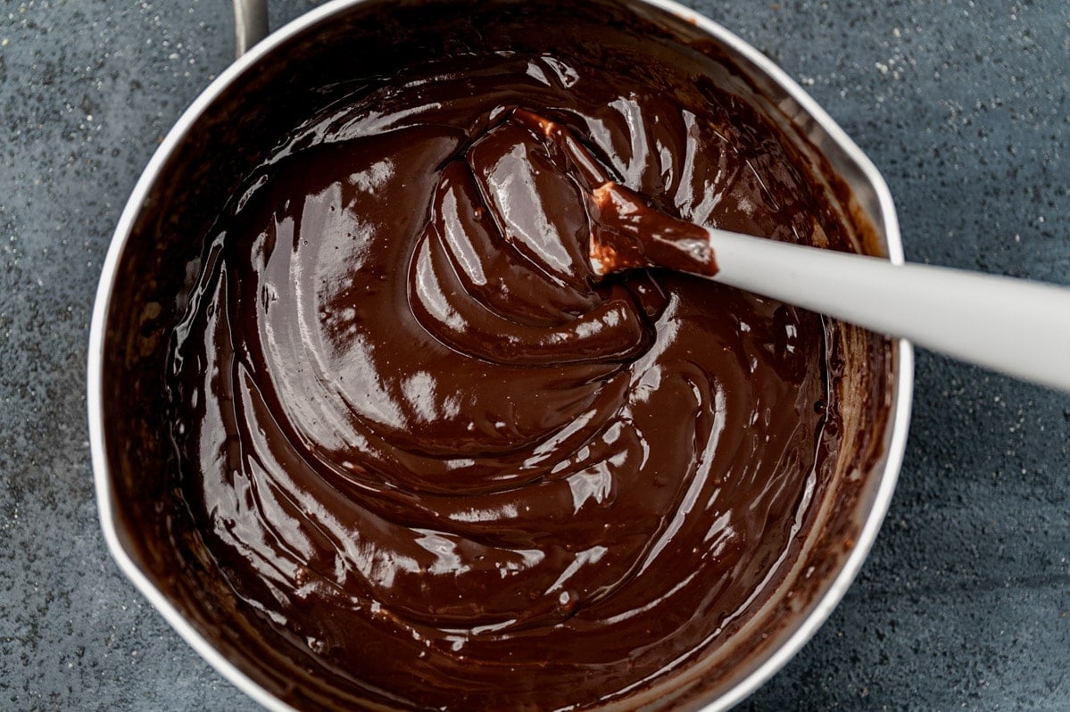 melted chocolate fondue in a saucepan